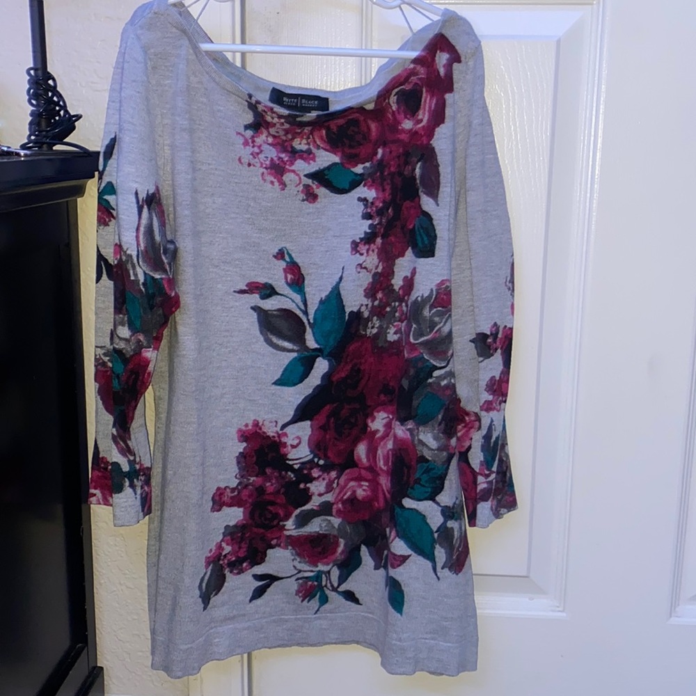 A sweater with maroon flowers and blue leaves it’s half sleeve barley worn